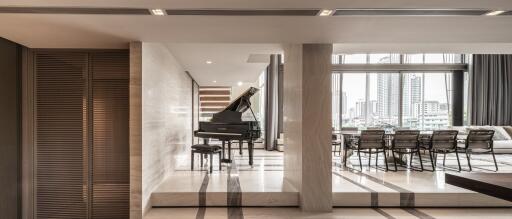 Spacious modern living room with piano and dining area