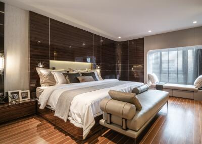 Spacious and elegantly designed bedroom with ample lighting