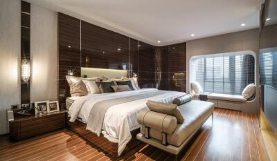 Spacious and elegantly designed bedroom with ample lighting