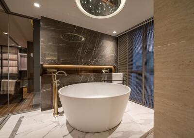 Modern bathroom with freestanding tub and luxurious marble detailing