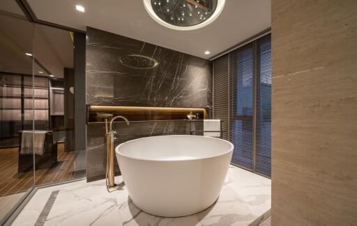 Modern bathroom with freestanding tub and luxurious marble detailing