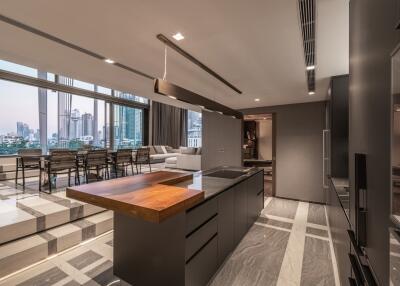 Modern kitchen with city view and dining area