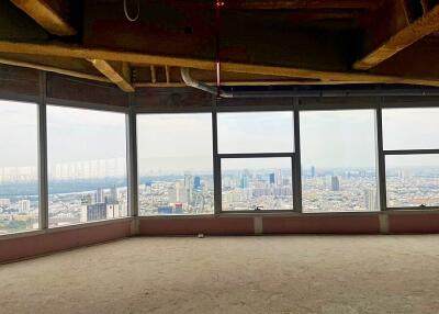 High-rise building interior with panoramic city view through large windows