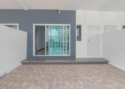 Spacious entryway of a modern building with tiled flooring