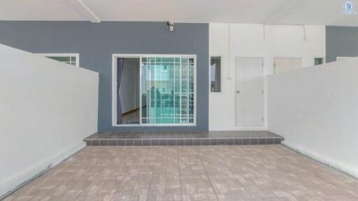 Spacious entryway of a modern building with tiled flooring