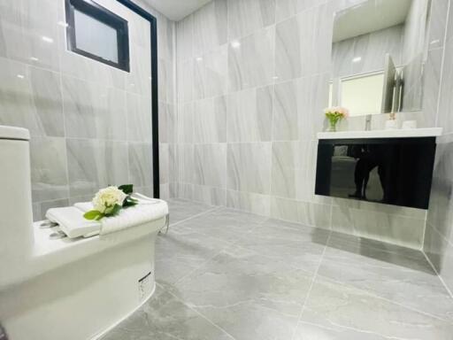 Modern bathroom with neutral color tiles and sleek design