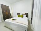 Modern bedroom with double bed and wardrobe