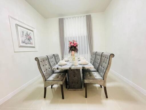 Elegant dining room with a set table and chairs