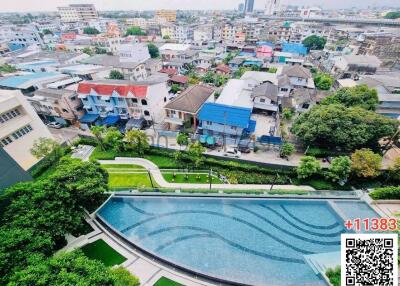 Aerial view of a residential area with a large swimming pool