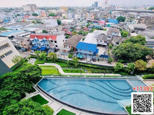 Aerial view of a residential area with a large swimming pool