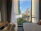 Modern bedroom with city view through large windows