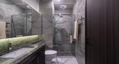 Modern bathroom interior with marble finishing and sleek fixtures