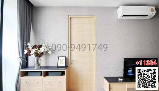 Modern bedroom interior with air conditioning unit and minimalistic decor