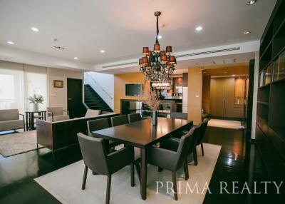 Spacious combined living and dining room with modern furnishings and ample natural light