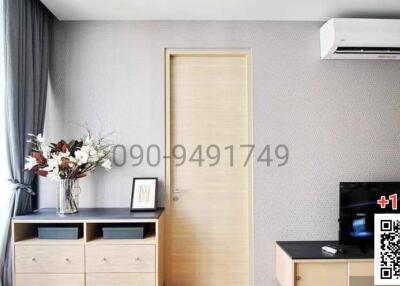 Modern bedroom with air conditioning and television