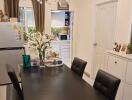 Elegant dining room with a modern chandelier and a large table