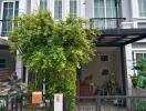 Front view of a modern townhouse with greenery