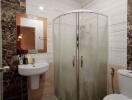 Modern bathroom interior with curved glass shower enclosure