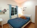 Cozy bedroom with wooden floors and Snoopy wall decorations