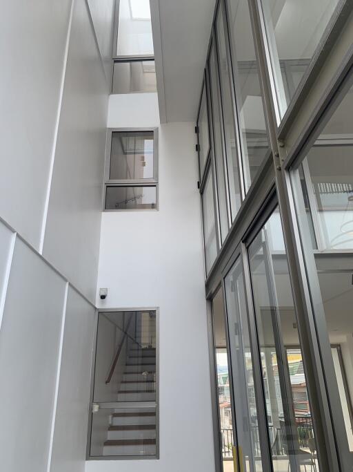 Modern building interior with high ceiling and large windows