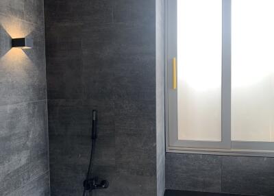 Elegant modern bathroom with bathtub and natural light