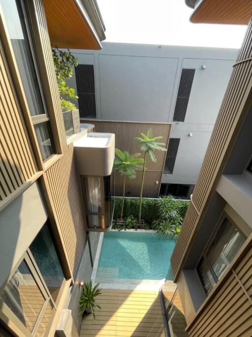 Modern residential complex with a pool view from the balcony