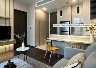 Modern living room with open kitchen design in a condo for rent in Klong Toei, Bangkok