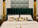 Modern bedroom with a large green upholstered headboard and stylish wall panels