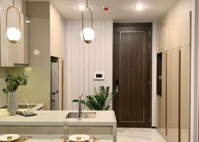 Modern kitchen with elegant pendant lights and a marble countertop