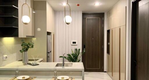 Modern kitchen with elegant pendant lights and a marble countertop