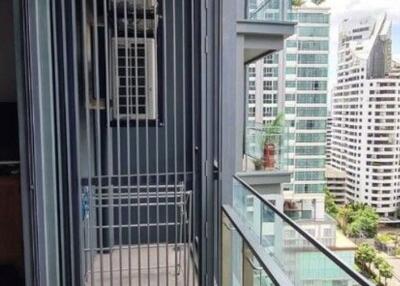 High-rise balcony with urban view and safety railing