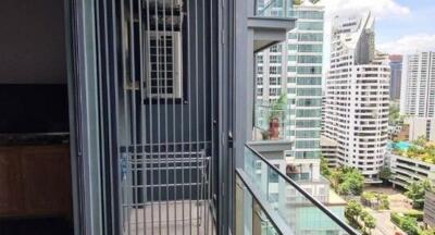 High-rise balcony with urban view and safety railing