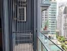 High-rise balcony with urban view and safety railing