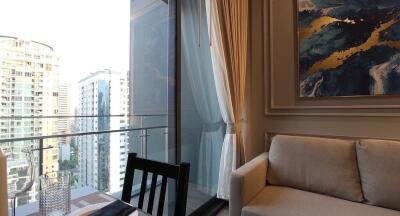 Cozy balcony with a view of the urban landscape, featuring comfortable seating and a glass railing