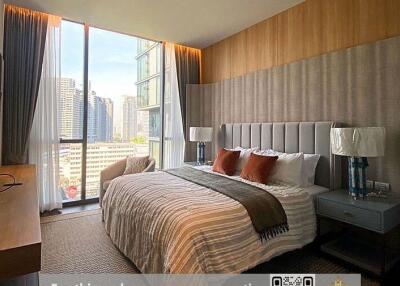 Contemporary bedroom with large windows and city view