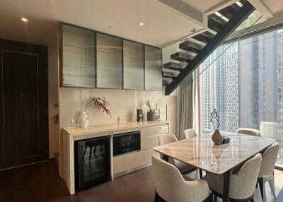 Modern kitchen with dining area and city view