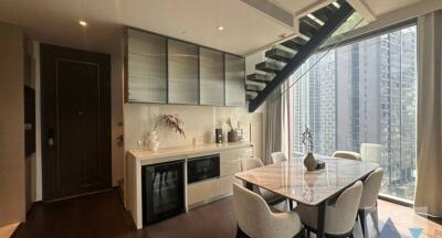 Modern kitchen with dining area and city view