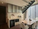 Modern kitchen with dining area and city view