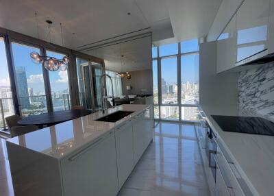 Modern kitchen with marble finishes and city view