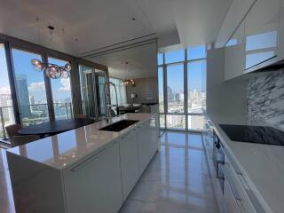 Modern kitchen with marble finishes and city view