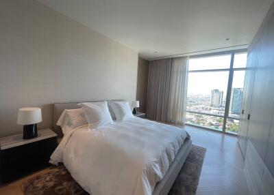 Spacious bedroom with city view and ample natural light