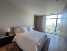 Spacious bedroom with city view and ample natural light