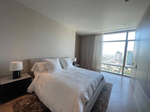 Spacious bedroom with city view and ample natural light