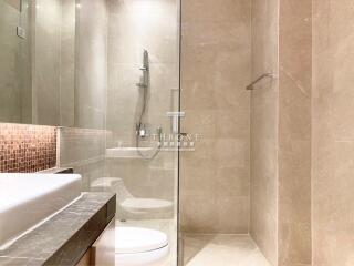 Modern bathroom with glass shower and elegant fixtures