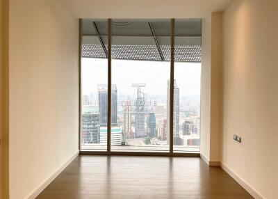 Empty interior space of a building with large window offering a city view
