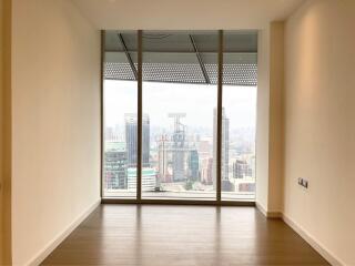 Empty interior space of a building with large window offering a city view