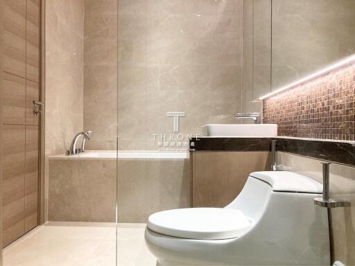 Modern bathroom with elegant fixtures and neutral tones