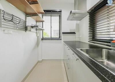 Modern kitchen with stainless steel appliances and granite countertops