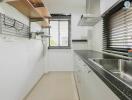 Modern kitchen with stainless steel appliances and granite countertops