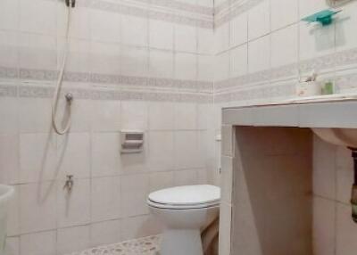 Bright and clean bathroom with tiled floors